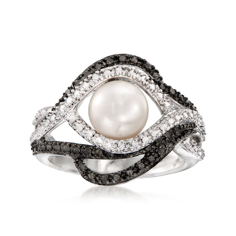 Sterling silver ring with round white cultured pearl center and dark stone accents