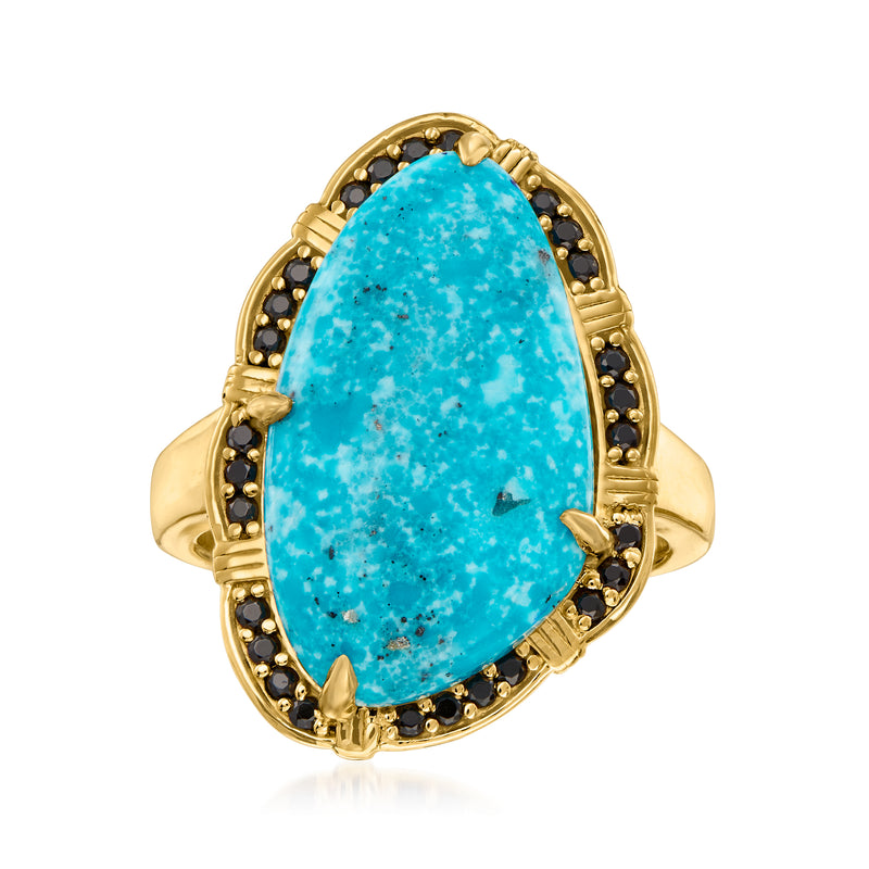 Gold over sterling ring with oval turquoise cabochon and black spinel halo
