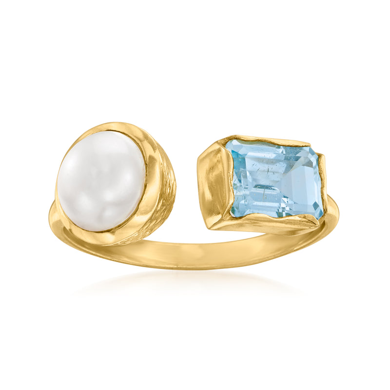 Gold ring with white pearl and sky-blue topaz in two-stone bezel setting