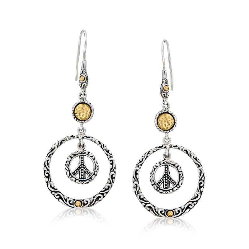 Silver drop earrings with round Bali-style frame and yellow-gold peace sign charm
