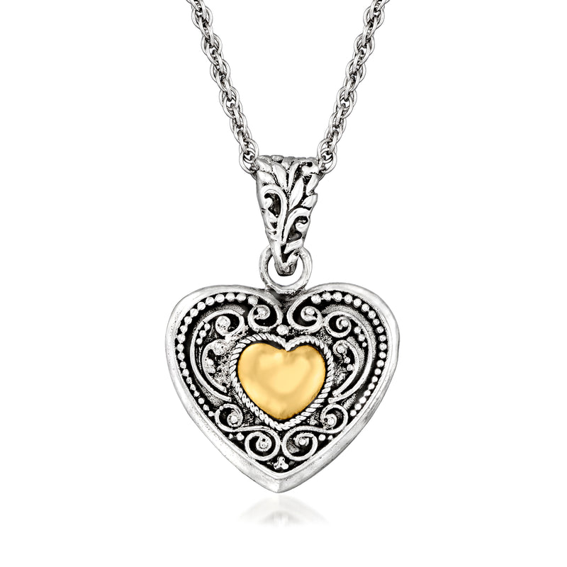 Sterling silver heart pendant necklace with ornate frame and yellow gold center heart