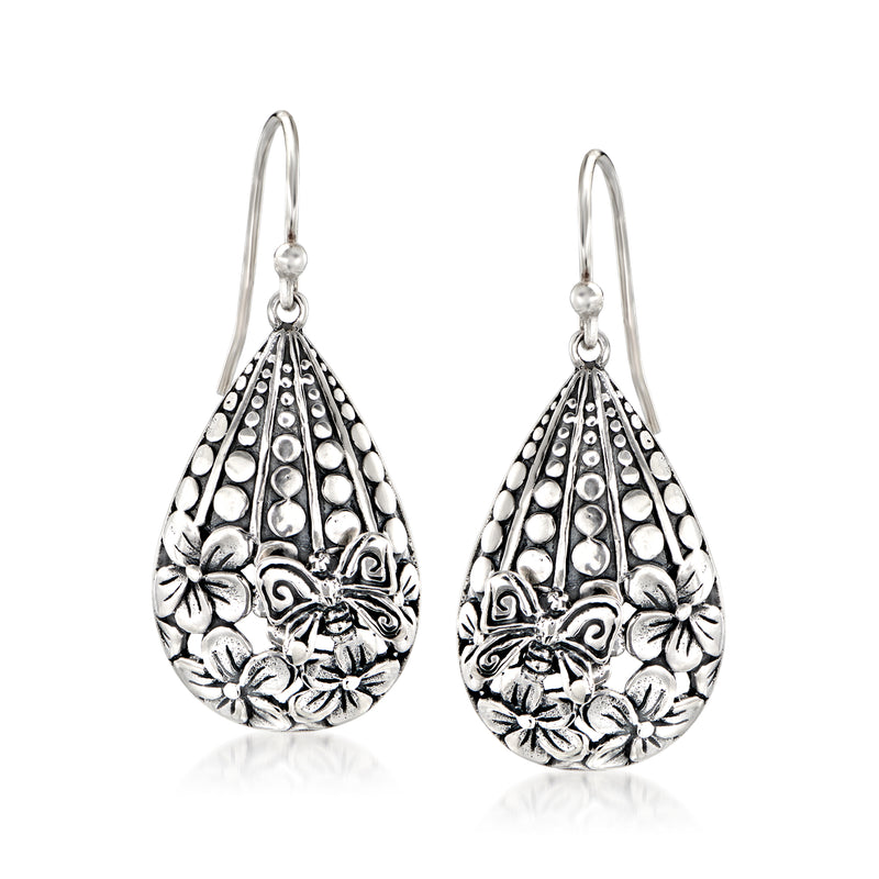 Sterling silver Bali-style drop earrings with etched flowers and butterfly in teardrop