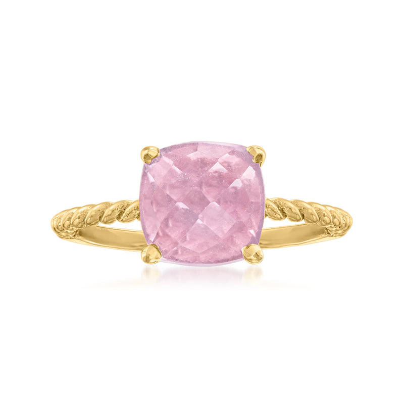 Amethyst solitaire ring with oval pink gemstone and four gold-toned prongs