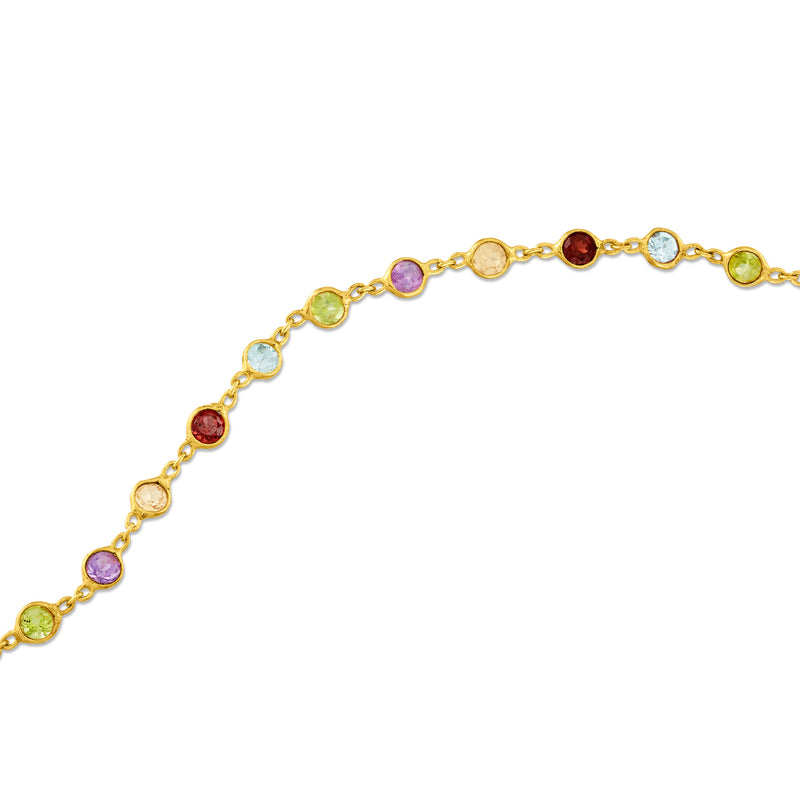 Gold over sterling anklet detail with round red, purple, green, and blue gemstones