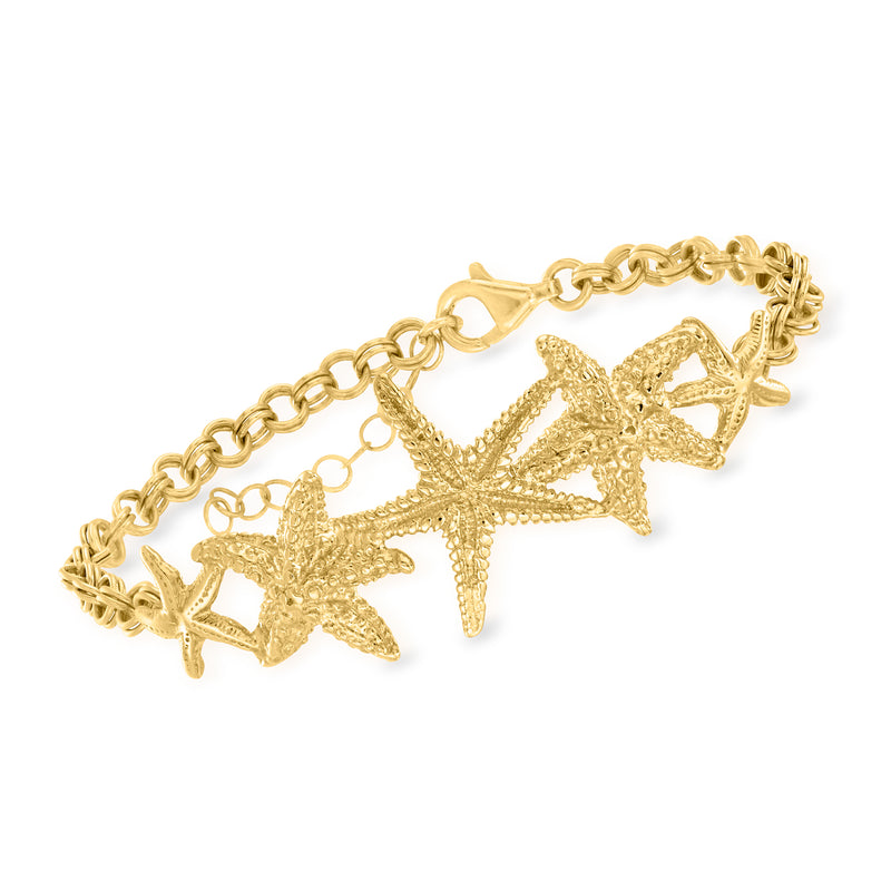 Gold-tone starfish charm bracelet with oval link chain and three textured starfish charms