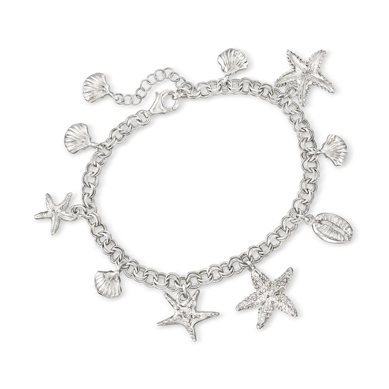 Sterling silver sea-life charm bracelet with starfish, seashells, and wave links