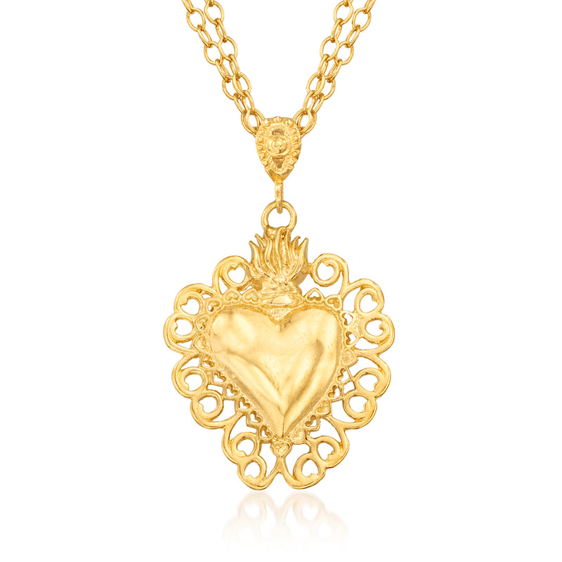 Gold heart pendant necklace with lace-style filigree design and dangling heart charm