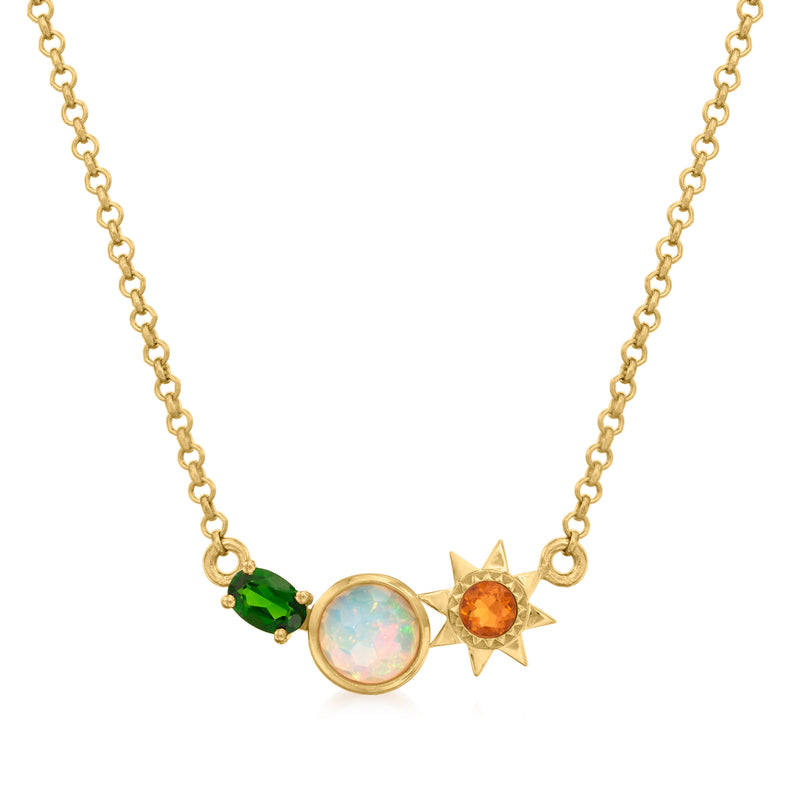 Gold-tone sun pendant necklace with opal center, orange gem, and green stone