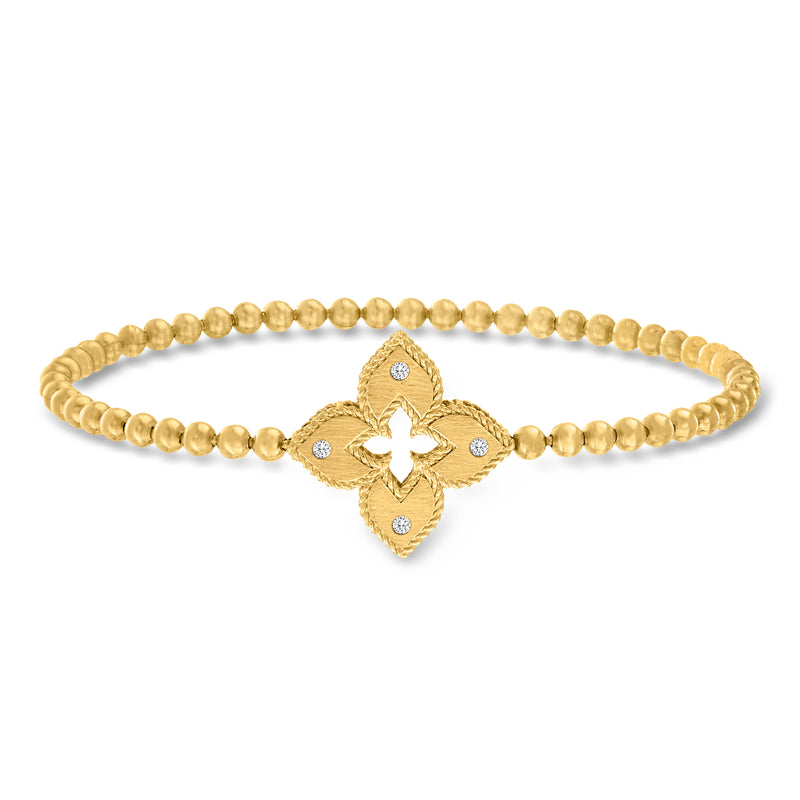 Yellow gold bead stretch bracelet with diamond cross motif and blue accents