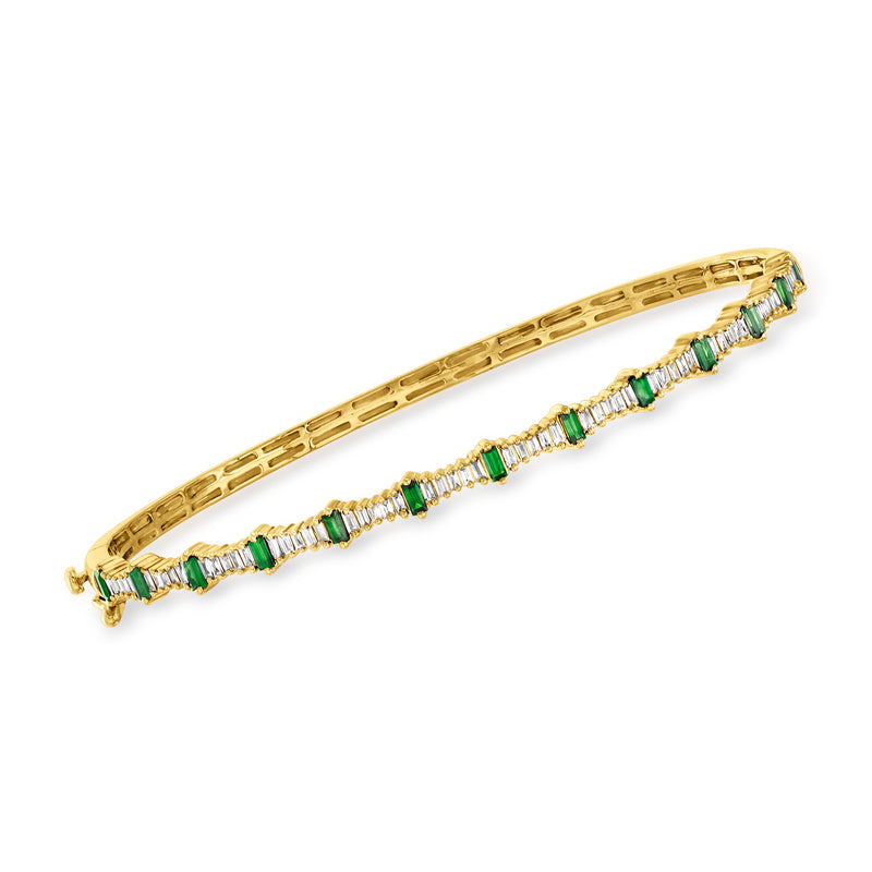 14kt yellow gold bangle bracelet with green baguette accents and diamond row