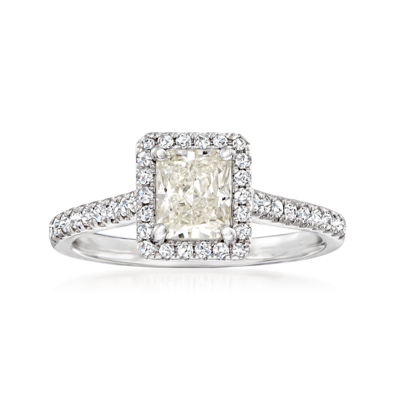 Diamond ring in 14kt white gold with rectangular center stone and halo