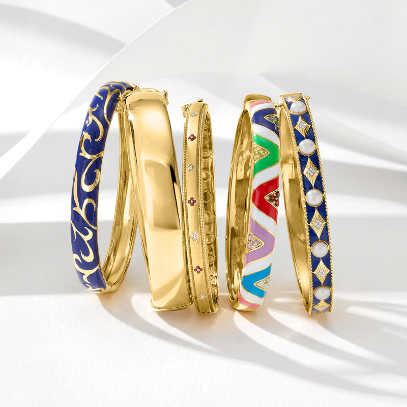 Blue enamel scroll bangle bracelet with gold-tone finish, stacked view