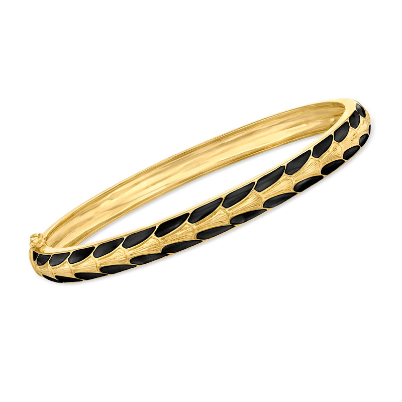 Gold-tone bangle bracelet with black enamel Art Deco pattern, hinged open oval cuff