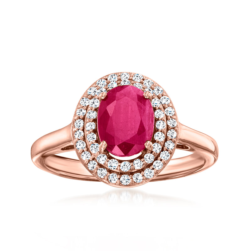 14kt rose gold ring with oval-cut ruby and diamond halo