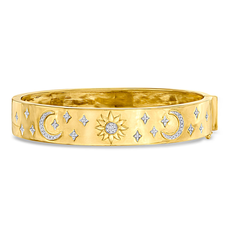 Gold celestial bangle bracelet with crescent moons, sun, and star accents