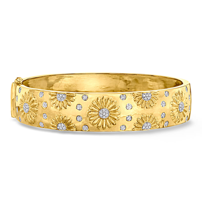 Gold over sterling bangle bracelet with sunflower motifs and round diamond-like stones