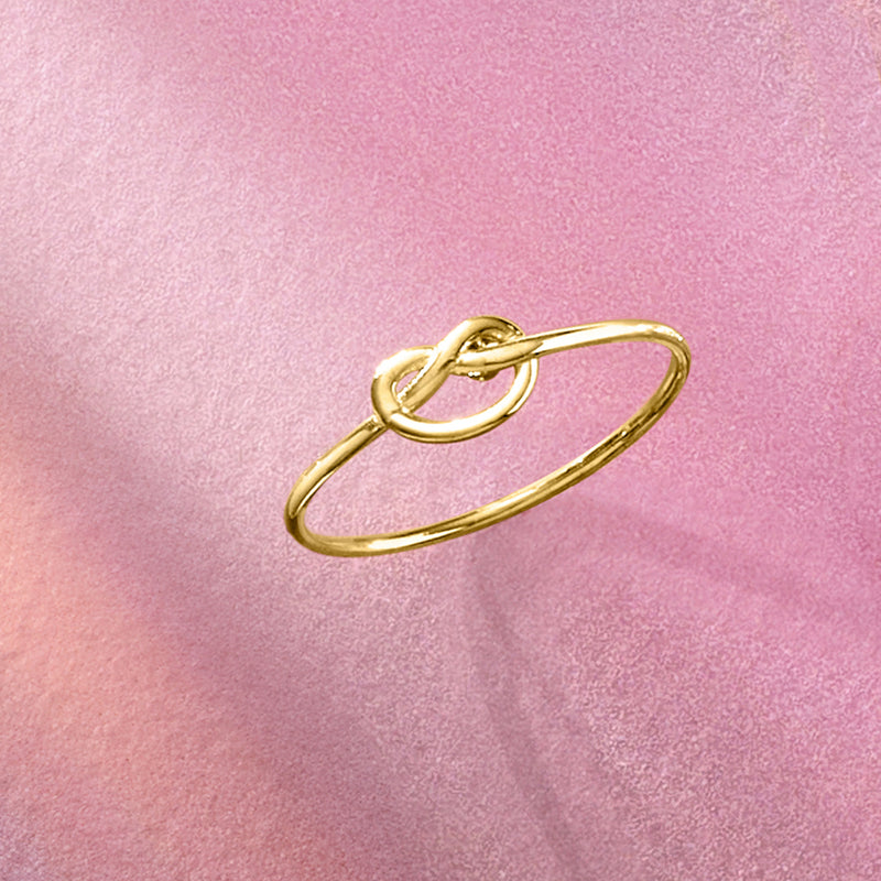 14kt yellow gold love-knot ring with linked circular loops, close-up