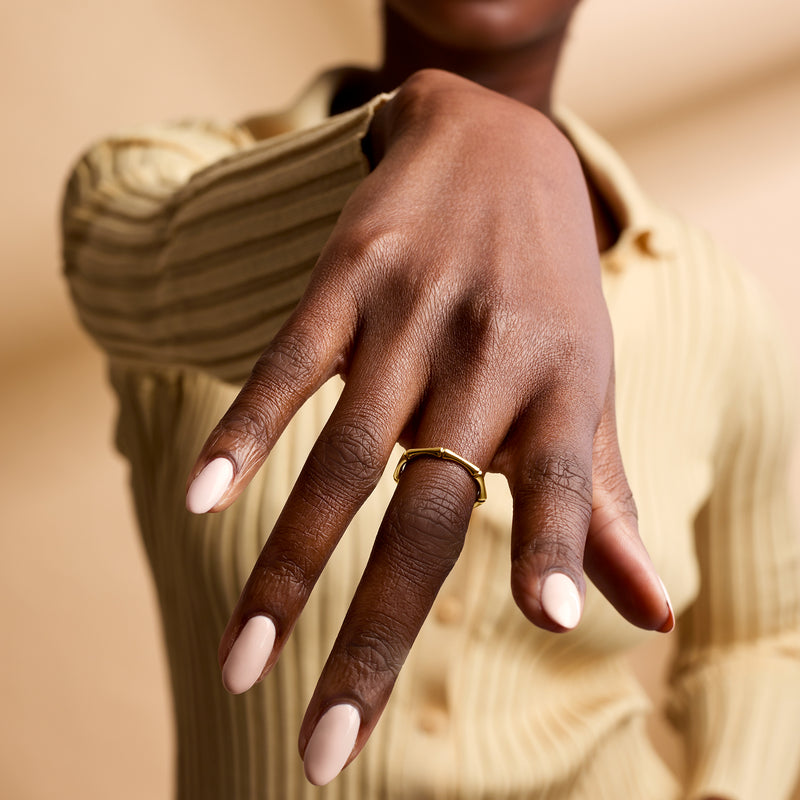 14kt yellow gold bamboo-style ring on finger