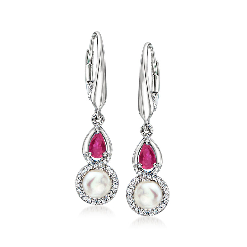 Sterling silver drop earrings with pink ruby teardrops, white cultured pearls, and diamond halos.