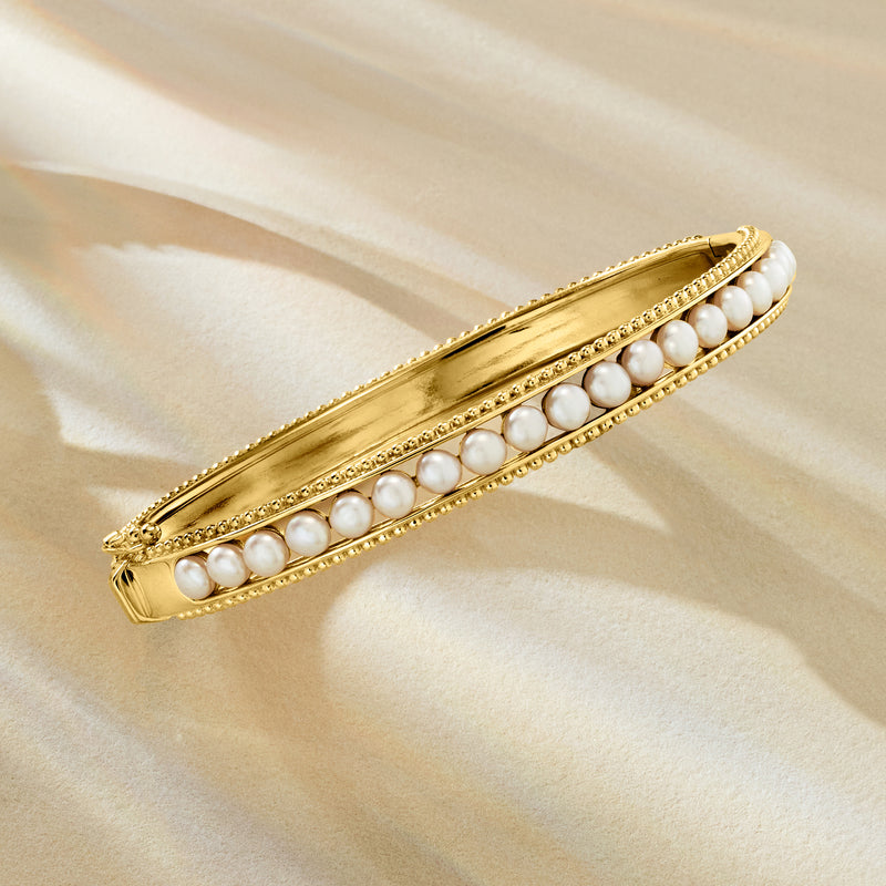 Gold-tone hinged bangle with two rows of round white cultured pearls