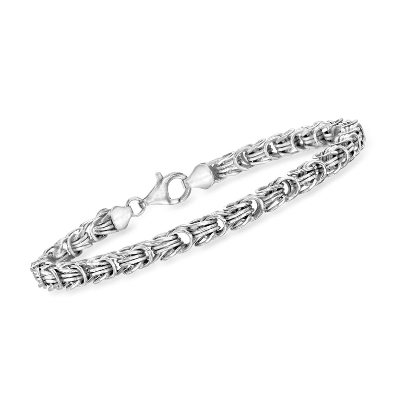 Sterling silver interlocking-link bracelet with alternating linked bands and toggle clasp