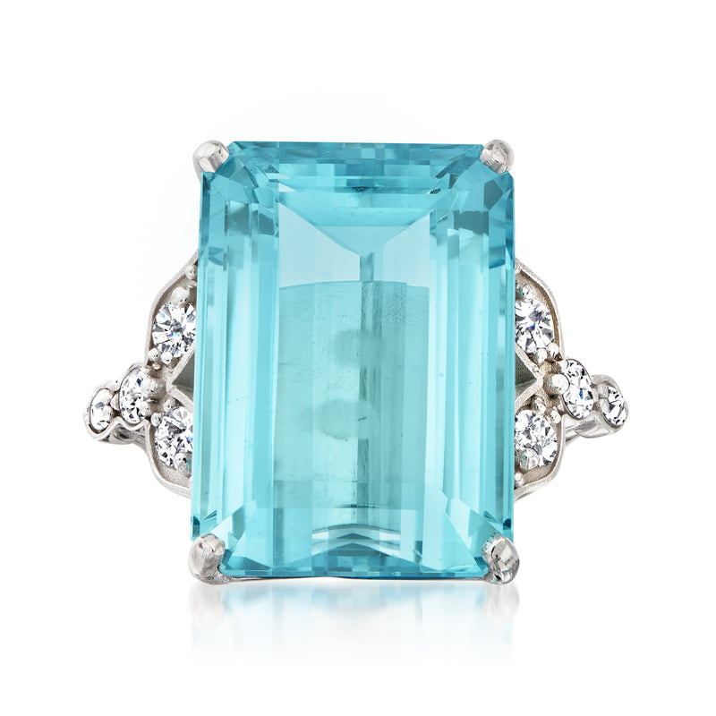14k white gold aquamarine ring with large emerald-cut blue gemstone and diamond side accents