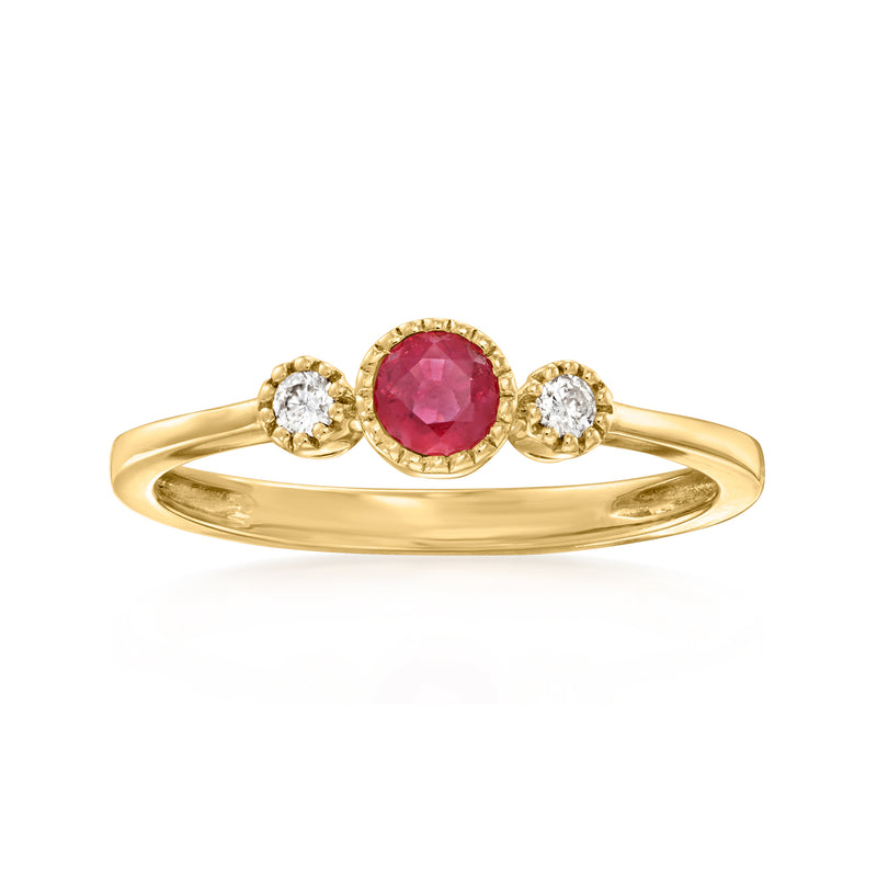 14kt yellow gold ring with round red ruby center and two diamond-like accents