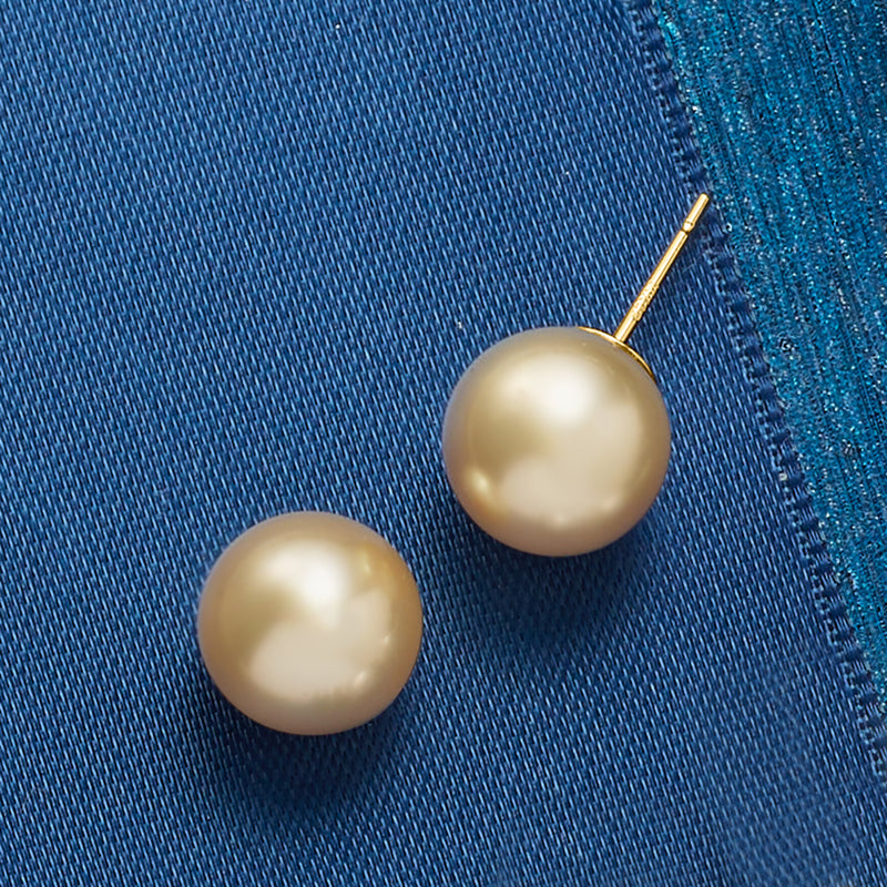 Round golden South Sea pearl stud earrings with 14kt yellow gold posts.