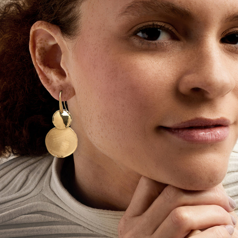 Gold circle drop earrings on earwire, textured round discs