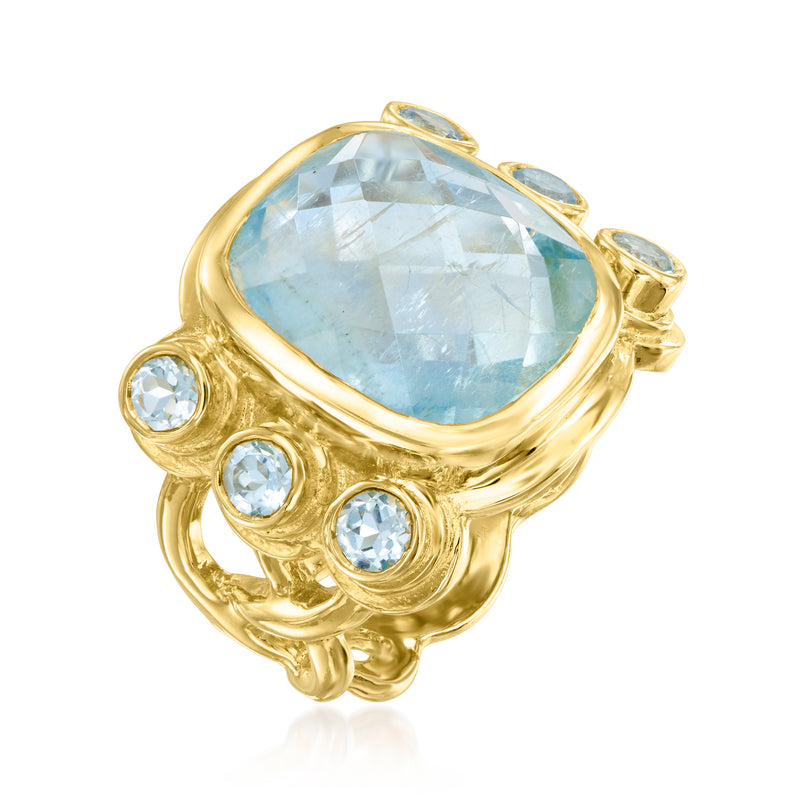 Gold over sterling ring with large oval light-blue aquamarine center and round sky blue side stones