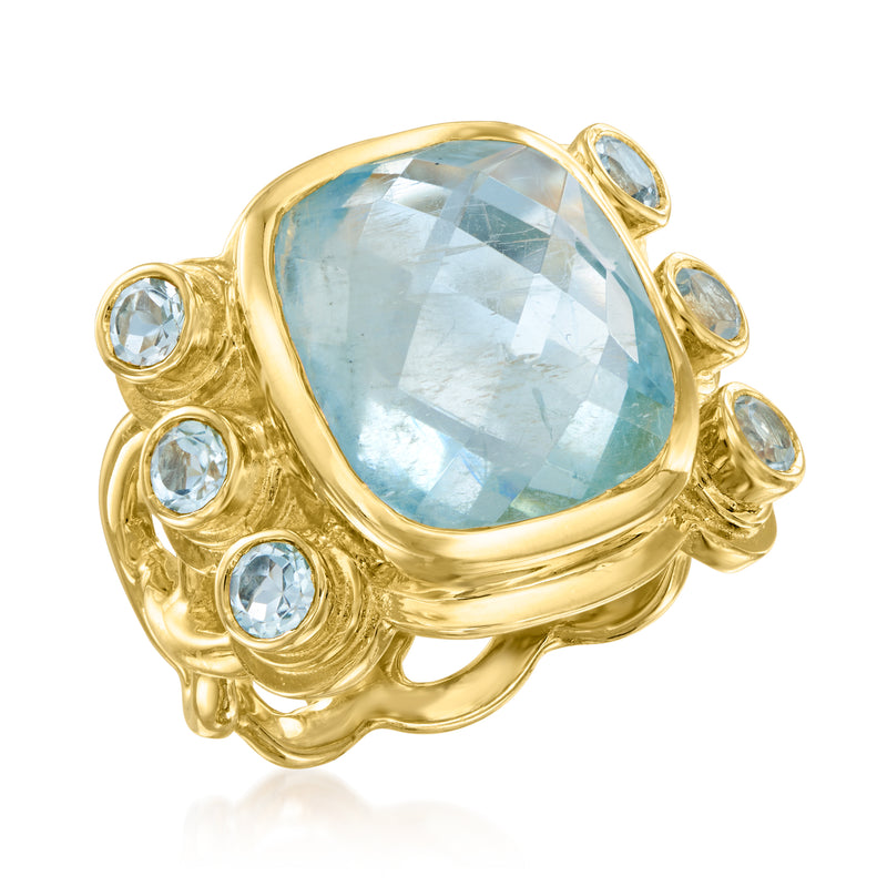 Aquamarine and sky blue topaz ring, gold over sterling, oval center with halo of round stones