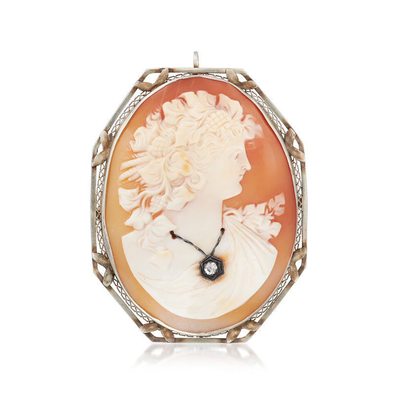 Oval orange shell cameo pendant in 14kt white gold with carved profile and filigree frame