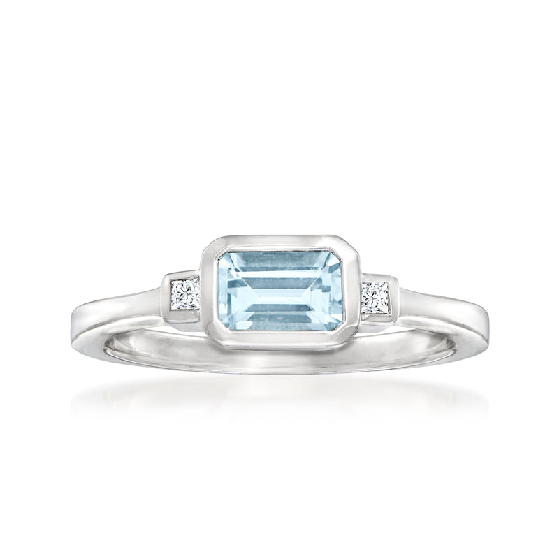 Aquamarine and diamond ring in 14kt white gold, emerald-cut center stone with side diamonds