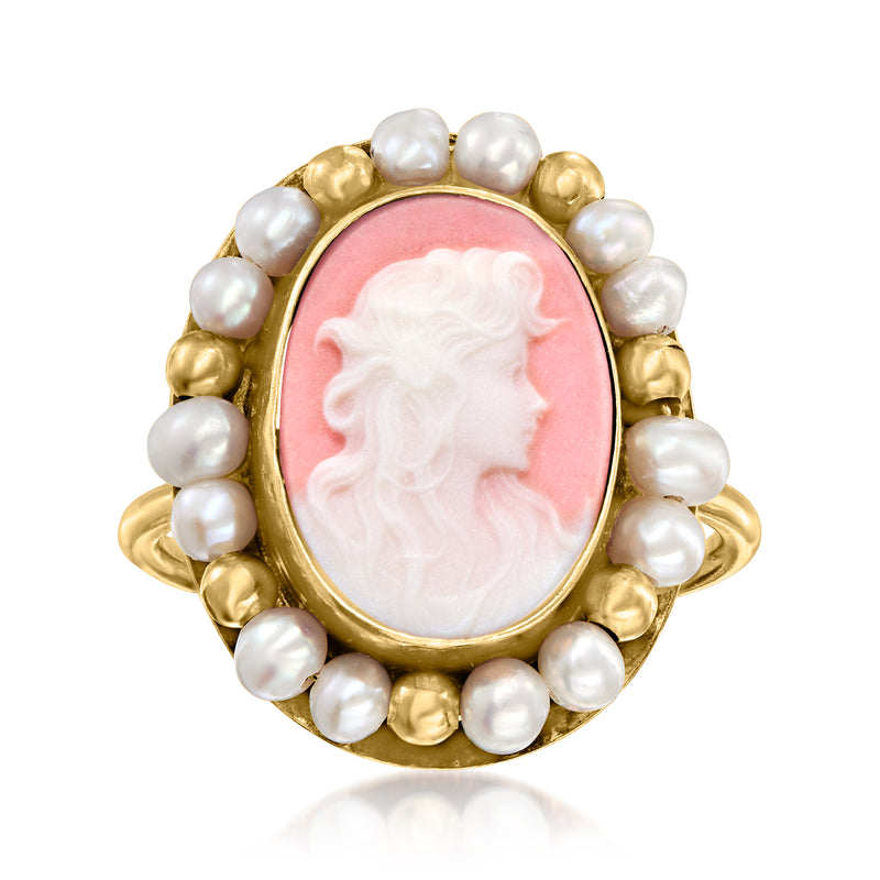 Gold-tone oval cameo ring with pink porcelain portrait and white profile, framed by cultured pearls