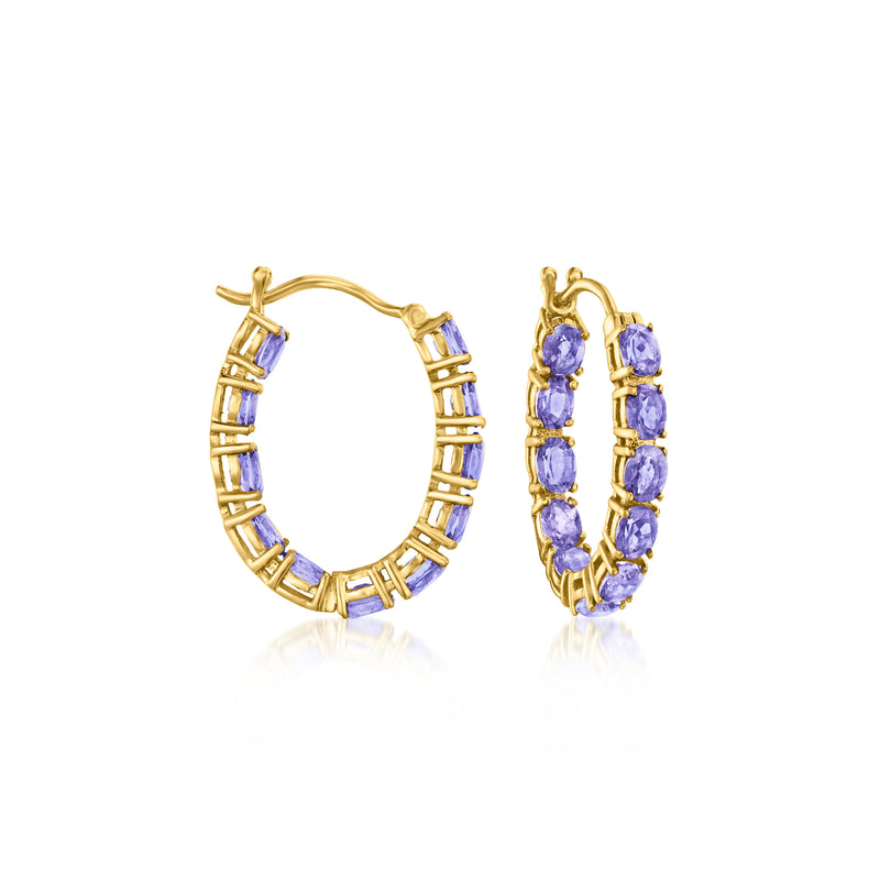 Gold hoop earrings with purple tanzanite-style stones on inner and outer rings