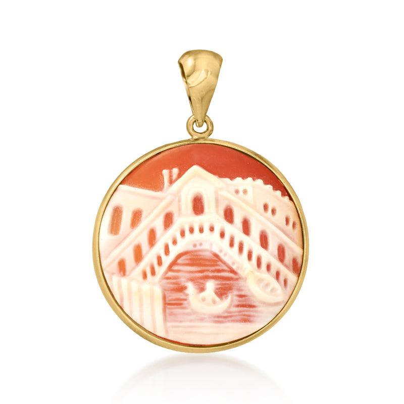 Orange shell cameo pendant with round gold bezel and carved profile scene