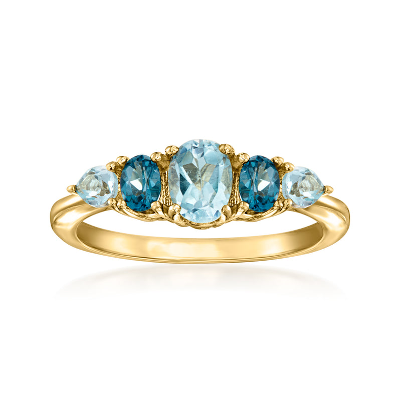 14kt yellow gold topaz ring with five oval blue gemstones in prong settings