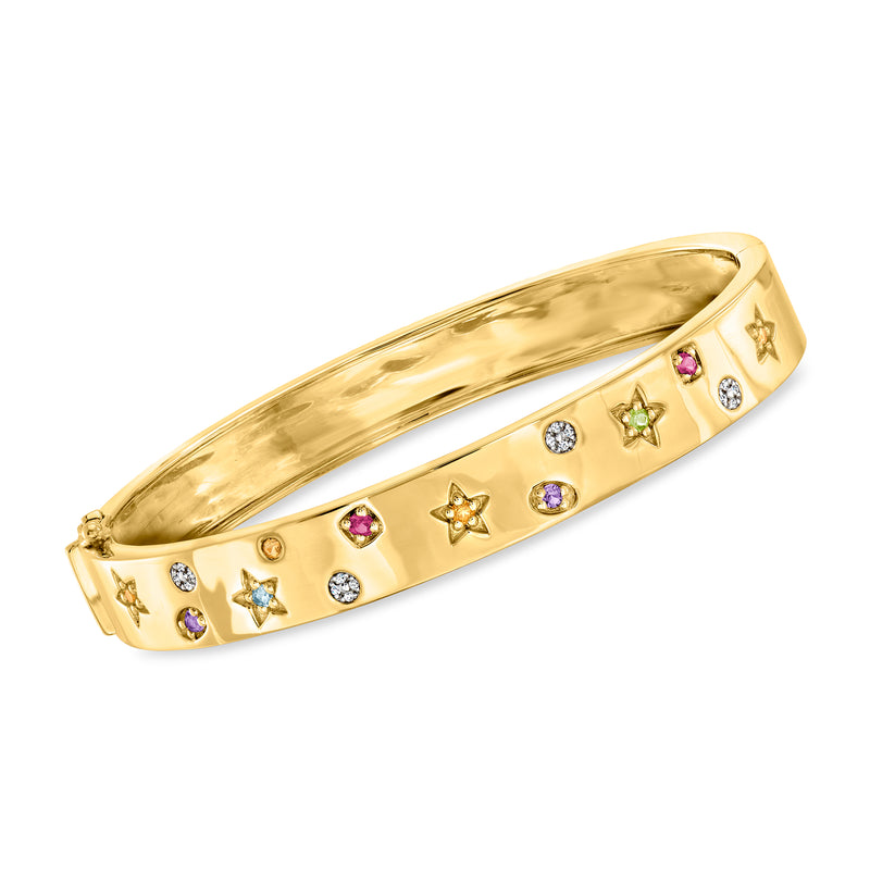 Gold-tone bangle bracelet with star charms, multicolor gemstones, and clear diamond accents