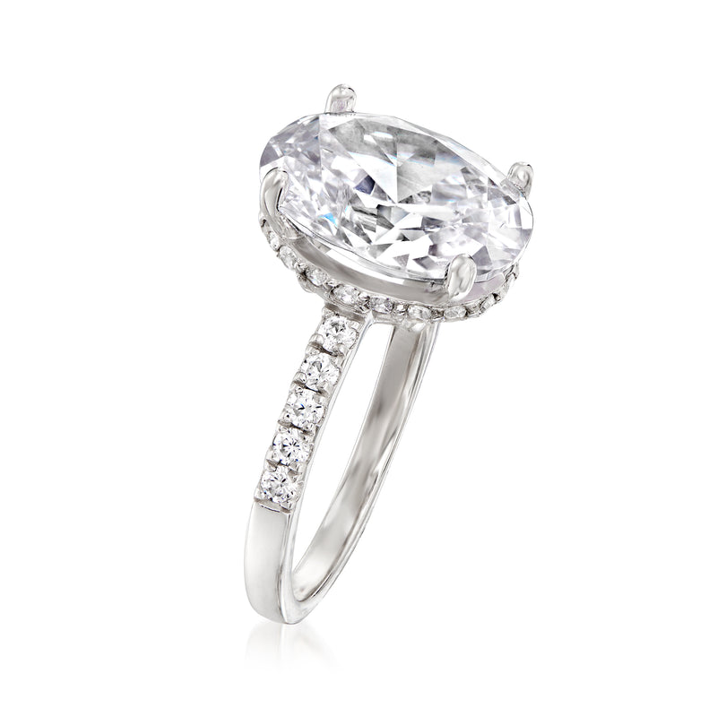 Sterling silver oval CZ ring with prong-set center stone and pave side bands
