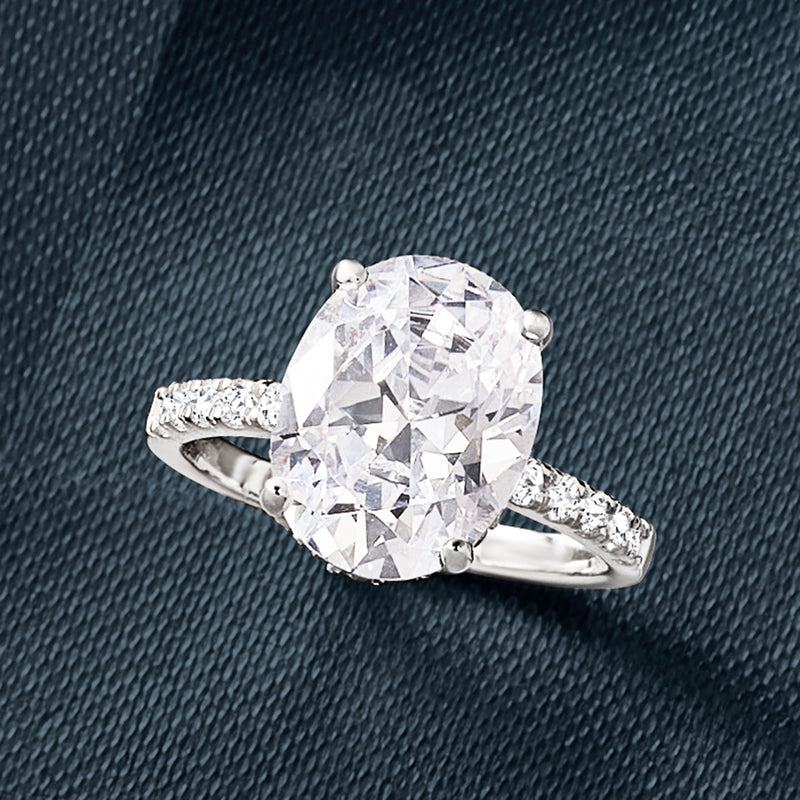 Sterling silver oval CZ ring with large center stone and textured pave shoulders
