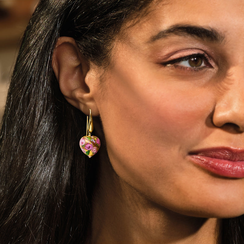 Multicolored heart drop earrings with gold earwire on model