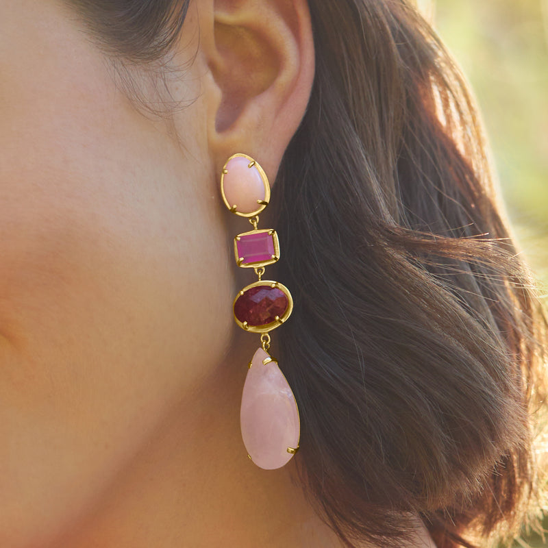 Gold drop earrings shown on ear: pink oval, pink square, red round, and pink teardrop