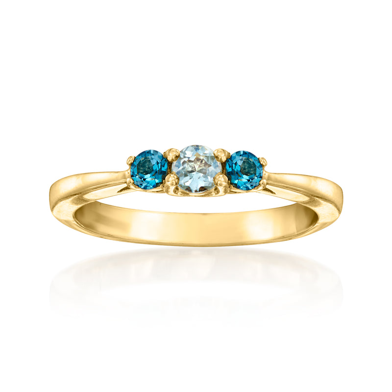 14kt yellow gold topaz ring with three blue round stones