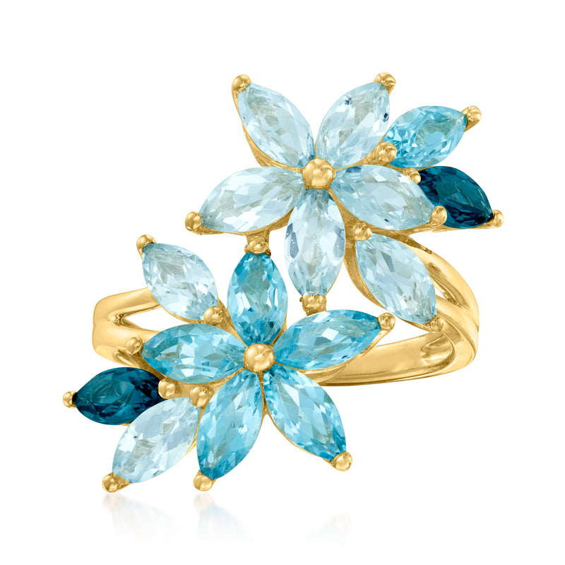 Gold over sterling floral ring with marquise blue topaz gemstones in petal design