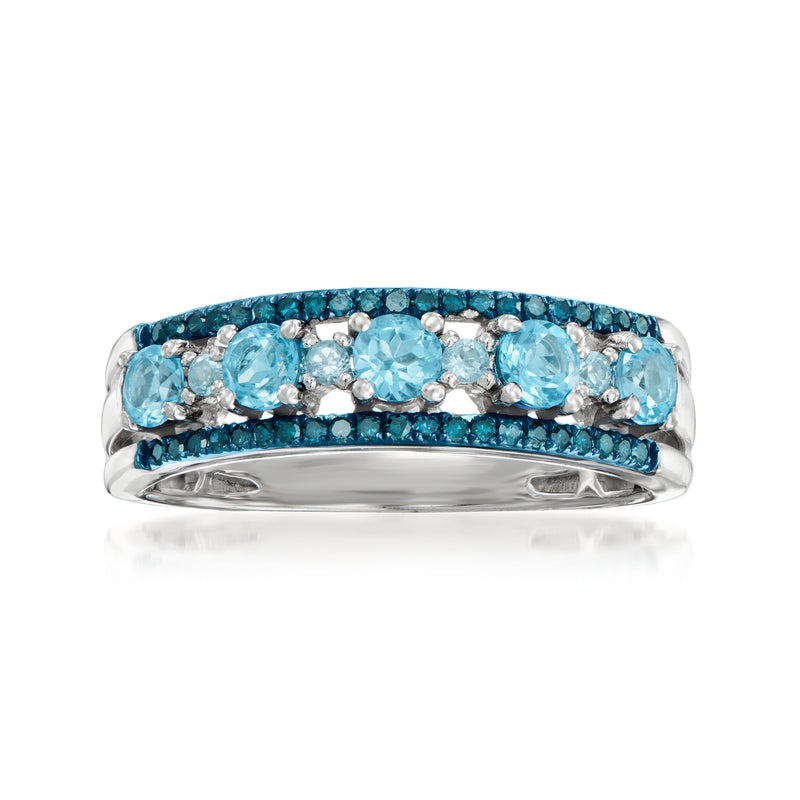 Sterling silver ring with oval sky-blue topaz and blue diamond accents, domed band.