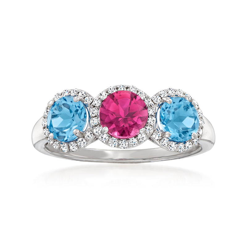 14kt white gold ring with oval blue topaz, pink center stone, and diamond halos
