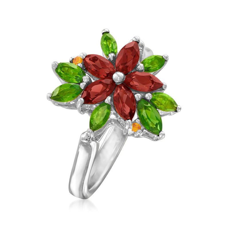 Sterling silver flower ring with large red center stone, green petals, and tiny orange gem
