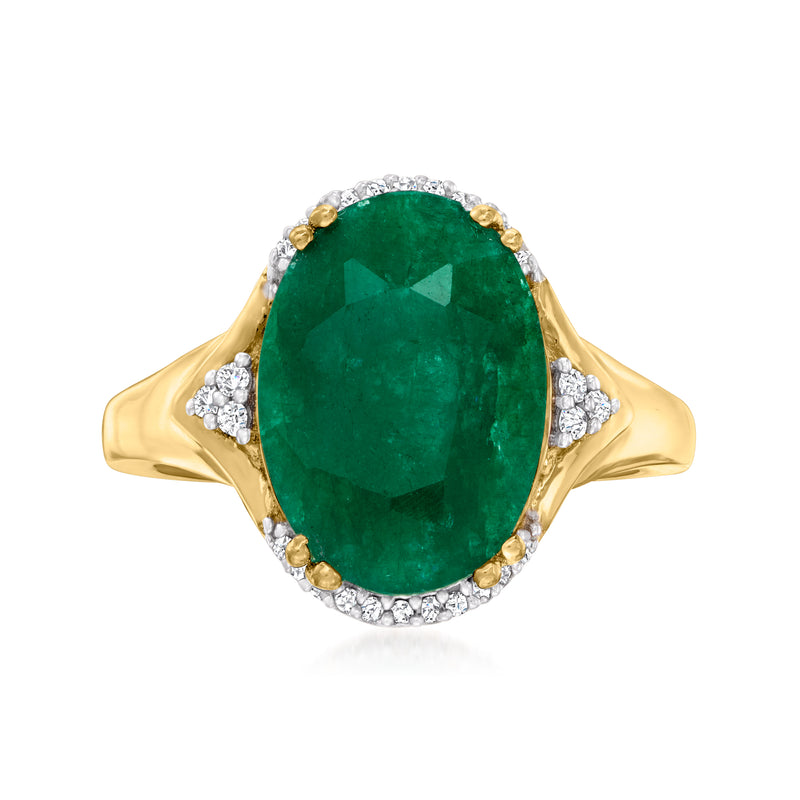 Gold ring with oval emerald-green gemstone, diamond halo, and gemstone prong details
