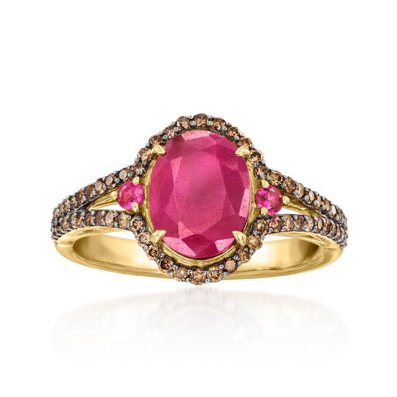 14kt yellow gold ring with oval pink ruby center, brown diamond halo and curved bands