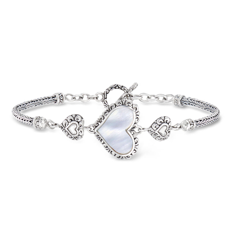 Sterling silver heart bracelet with mother-of-pearl center and braided link details